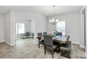 Stylish dining room with a rustic table and chairs is adjacent to a bright office space at 404 Brannon Meadows Dr # 270, York, SC 29745