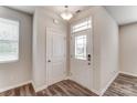Bright entryway featuring a glass-paneled front door, vinyl flooring, and a convenient coat closet at 4102 Cheyney Park Dr, Charlotte, NC 28269