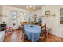A formal dining room featuring a large table and a vintage chandelier at 517 Stockton St, Statesville, NC 28677