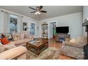 Comfortable living room with a fireplace, plush sofas, and a view into other rooms at 517 Stockton St, Statesville, NC 28677