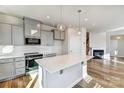 Modern kitchen features an island, stainless steel appliances, and ample counter space at 8039 Downy Oak Ln, Charlotte, NC 28269