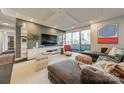 Spacious living room with gray walls, decorative shelving, and a large sliding glass door at 1300 Reece Rd # 201, Charlotte, NC 28209