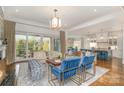 Open-concept living room with a view of the backyard and a modern kitchen at 1328 S Kings Dr, Charlotte, NC 28207