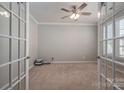 Bright office with a ceiling fan, neutral walls, carpeted floors and French doors at 146 Stibbs Cross Rd, Mooresville, NC 28115