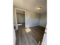 Bright living room with light gray walls and wood-look flooring, offering a spacious and welcoming atmosphere at 206 Lincoln St, Badin, NC 28001