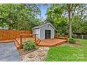 Backyard shed with a deck, offering storage and outdoor relaxation at 2115 Laburnum Ave, Charlotte, NC 28205
