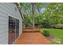 Spacious deck area beside a shed in a lush backyard, ideal for relaxation at 2115 Laburnum Ave, Charlotte, NC 28205