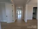 Bright hallway featuring hardwood floors and modern white trim at 251 Luray Way # 441, Rock Hill, SC 29730