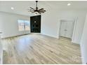 Bright living room with wood floors, a fireplace, and ceiling fan at 2705 Eagle Dr, Lincolnton, NC 28092