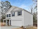 Side view of a two-story home with light gray siding, blue shutters, and a two-car garage; showcasing its architectural design at 5156 Fireweed Ct, Dallas, NC 28034