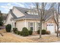 Charming exterior view showcases the home's stone accents, neutral siding, and well-maintained landscaping at 526 Pine Links Dr, Tega Cay, SC 29708