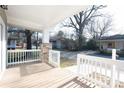 Inviting covered porch features stone columns and an eye-catching railing at 533 3Rd St, Chester, SC 29706