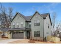 Beautiful new construction home featuring a two-car garage, craftsman details, and a sodded front yard at 600 Campus St, Charlotte, NC 28216