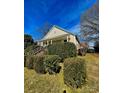 Charming home featuring a covered front porch with columns and mature landscaping adding curb appeal at 8508 Colgate Cir, Charlotte, NC 28214