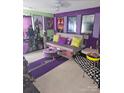 Eclectic bedroom with colorful walls, decorative movie posters, playful accents, and unique personal touches at 10415 Plantain Ct, Charlotte, NC 28213