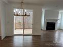 Dining area with hardwood floors, chandelier, and sliding glass doors to a deck at 107 Spring View Ln, Statesville, NC 28677