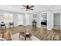 Comfortable living room featuring light gray walls and wood-look floors at 1075 Wellman St, Gastonia, NC 28054