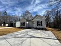 Attractive single-story home features a well-manicured lawn and a paved driveway at 1114 Kenly St, Salisbury, NC 28144