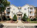 Attractive condo exterior featuring multiple balconies and well maintained landscaping at 17137 Red Feather Dr, Charlotte, NC 28277