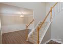 Bright entryway features classic staircase and a view into the formal dining room at 2043 Covered Bridge Ct, Rock Hill, SC 29732