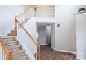 Spacious entryway features staircase with wood and white trim, and hardwood floors at 2043 Covered Bridge Ct, Rock Hill, SC 29732