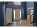 Open foyer features wood flooring, tall ceilings, and white doors at 2043 Covered Bridge Ct, Rock Hill, SC 29732
