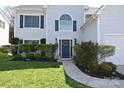 Inviting front entrance with a wreath, arched window, and landscaping at 2043 Covered Bridge Ct, Rock Hill, SC 29732