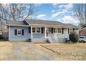 Attractive single story home with brick veneer, dark shutters, and a well-maintained lawn at 4930 Crestmont Dr, Charlotte, NC 28205