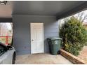 Covered carport with ample space for parking and storage, featuring a convenient side entry door at 818 W 6Th St, Newton, NC 28658