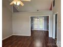 Bright living room featuring hardwood floors, vaulted ceilings and a glass door for tons of natural light at 823 Prestwick Dr, Rock Hill, SC 29730