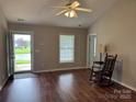 The home features hardwood floors, a ceiling fan and large window for plenty of natural light at 823 Prestwick Dr, Rock Hill, SC 29730