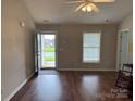 View of the front entry door as well as the hardwood flooring and two windows for plenty of natural light at 823 Prestwick Dr, Rock Hill, SC 29730