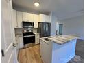 Well-appointed kitchen with stainless steel appliances and ample cabinet space at 916 Moose St, Lowell, NC 28098