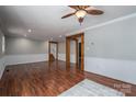 Spacious living room with wood-look floors, neutral walls, and ample natural light at 939 Dameron Rd, Bessemer City, NC 28016
