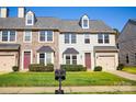 Charming townhomes with manicured lawns, inviting entrances, and well-maintained exteriors, perfect for Gathering living at 9760 Springholm Dr, Charlotte, NC 28278
