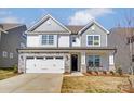 Charming two-story home with stone accents and well-manicured lawn, creating a welcoming curb appeal at 108 Ellsworth Rd # 40, Mooresville, NC 28115