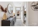 Inviting entryway featuring modern decor, a stylish console table, and natural light at 1108 Wesley Terrace Ave, Charlotte, NC 28208