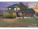 This home features a backyard and screened-in porch, perfect for outdoor living at 1511 35Th Ne Ave, Hickory, NC 28601