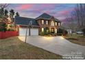 Charming two-story brick home with inviting front yard at dusk at 1511 35Th Ne Ave, Hickory, NC 28601