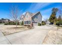 Charming home featuring stone and siding exterior, well-manicured landscaping, and a paved driveway at 8471 Penton Pl, Harrisburg, NC 28075