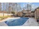Inviting backyard pool with a well-maintained deck and mature trees adding privacy to the outdoor space at 1006 Lost Cv, Weddington, NC 28104