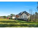 Lovely home exterior with lush lawn and landscaping on a sunny day at 2013 Gladelynn Ct # 354, Belmont, NC 28012