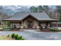 Beautiful home with stone accents, covered porch, double door entry, and meticulous landscaping at 406 Third Ne Ave, Conover, NC 28613