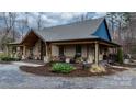 Charming single story home with covered porch, stone accents, and landscaped front yard at 406 Third Ne Ave, Conover, NC 28613