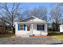 Charming home featuring blue shutters and a well-maintained front yard at 417 Baker Street Ext, Rock Hill, SC 29730