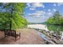 Beautiful lake view featuring bench sitting near the water at 537 Southeast Dr # 537, Davidson, NC 28036