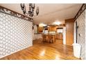 Open concept kitchen with wooden cabinets, an island, and hardwood floors at 6000 George Hildebran School Rd, Hickory, NC 28602