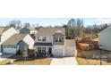 Aerial view of a two-story home with a two-car garage in a residential neighborhood at 9022 Colwick Hill Ln, Charlotte, NC 28215