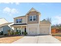 Beautiful two-story home with a two-car garage and inviting curb appeal at 9022 Colwick Hill Ln, Charlotte, NC 28215
