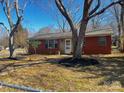 Lovely single-story brick home showcasing mature trees and a freshly mulched front yard at 926 Overhill St, Gastonia, NC 28052
